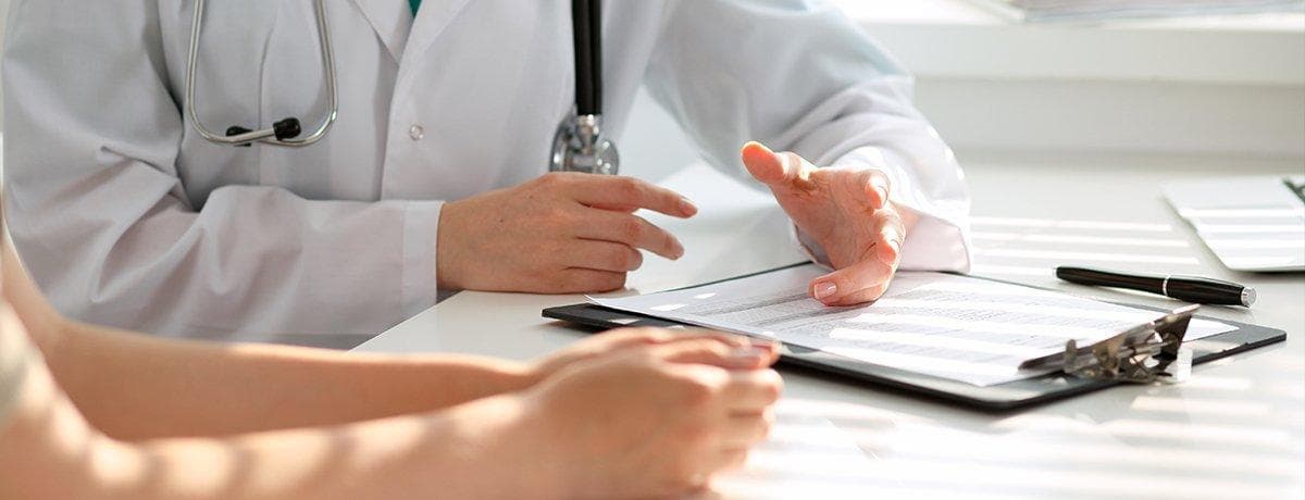 A consultation at the desk with Dr. Kushnick